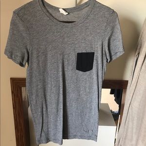 Plain grey T w a black pocket
